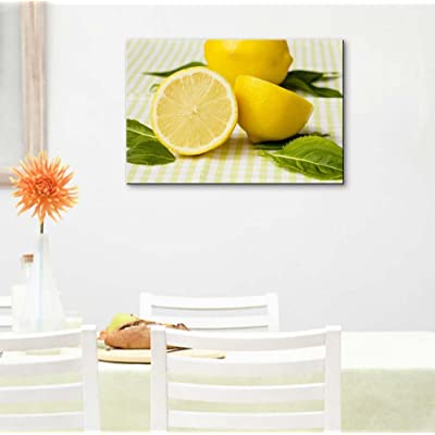 lemon fruit themed kitchen decor on a wall above a table