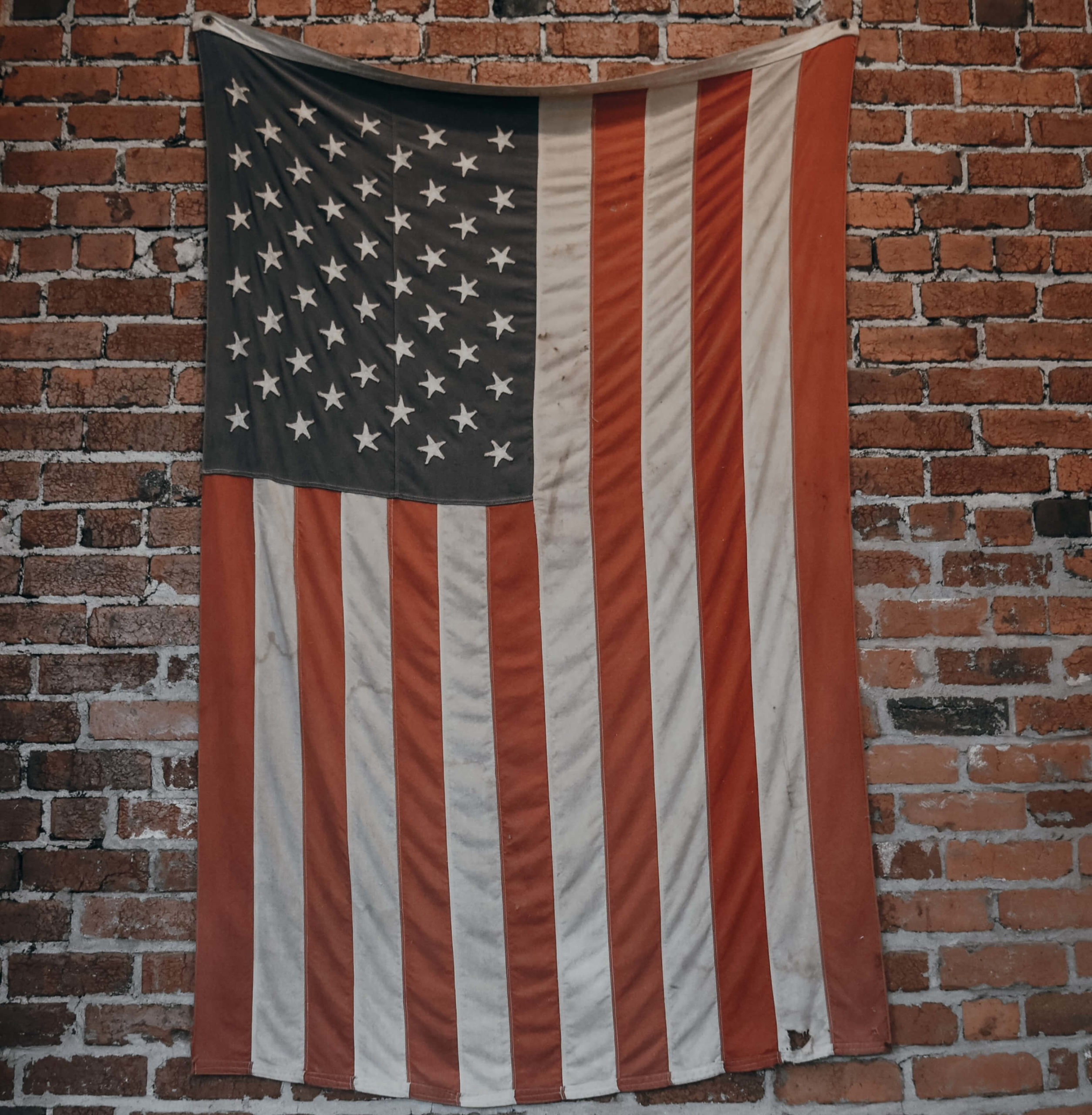 American flag on a brick wall