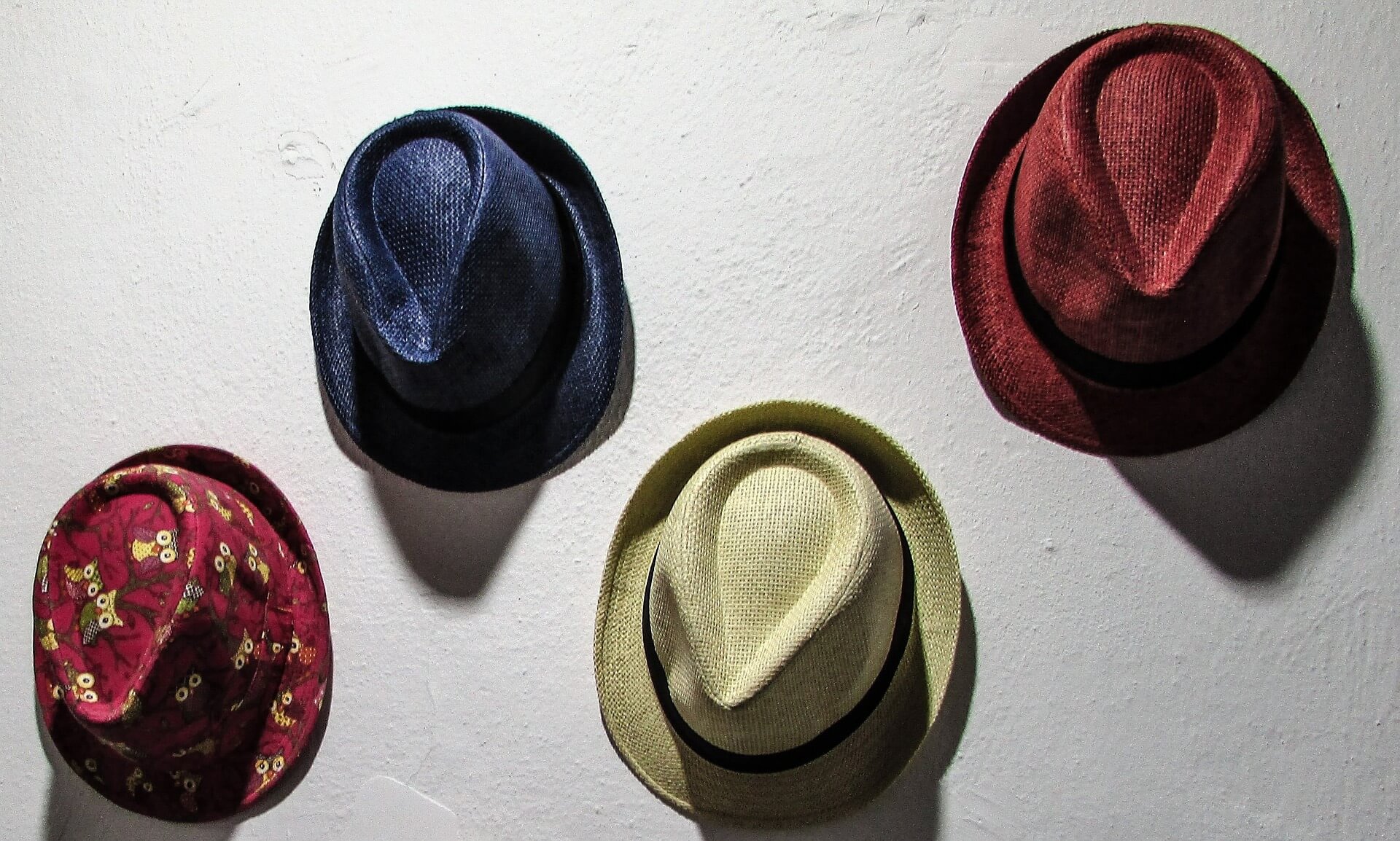 hats hanging from the wall