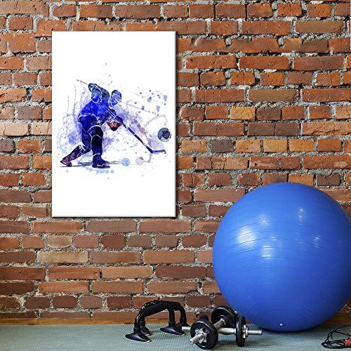hockey wall art on a brick wall with weights and workout ball ont he floor