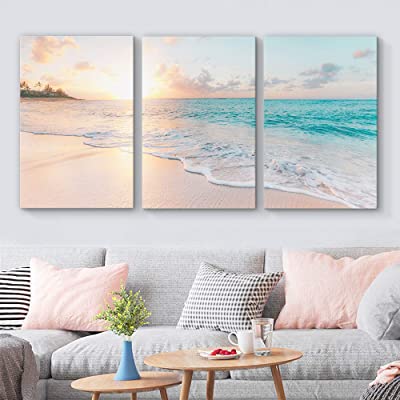 beautiful canvas art of the ocean during sunrise as beach house decorating ideas