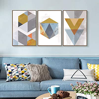 3 geometric paintings with matching pillows