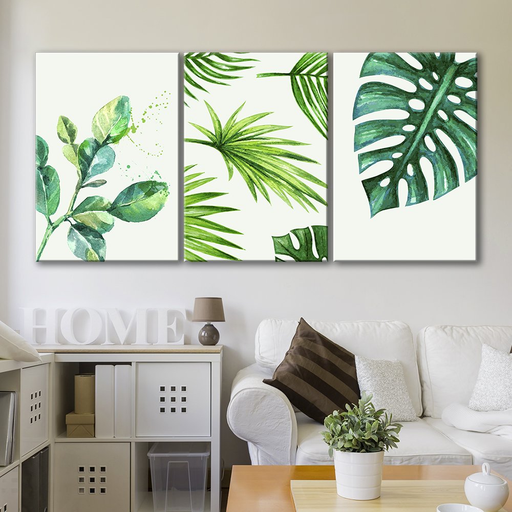 botanical canvas art loighting up a room with a white couch
