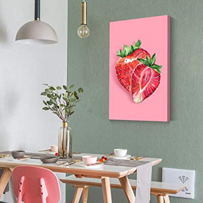 Strawberry fruit themed kitchen decor on a green wall over an eating area