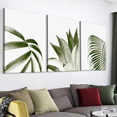 amazing leaf themed living room with wall art above the couch