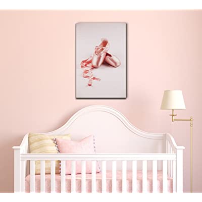 canvas wall art featuring pointe shows over a crib
