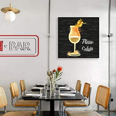 pina colada art above a bar style table in a home