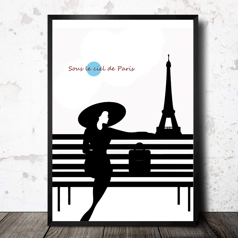 framed art print of a fashionable woman sitting on a bench in front of the eifel tower