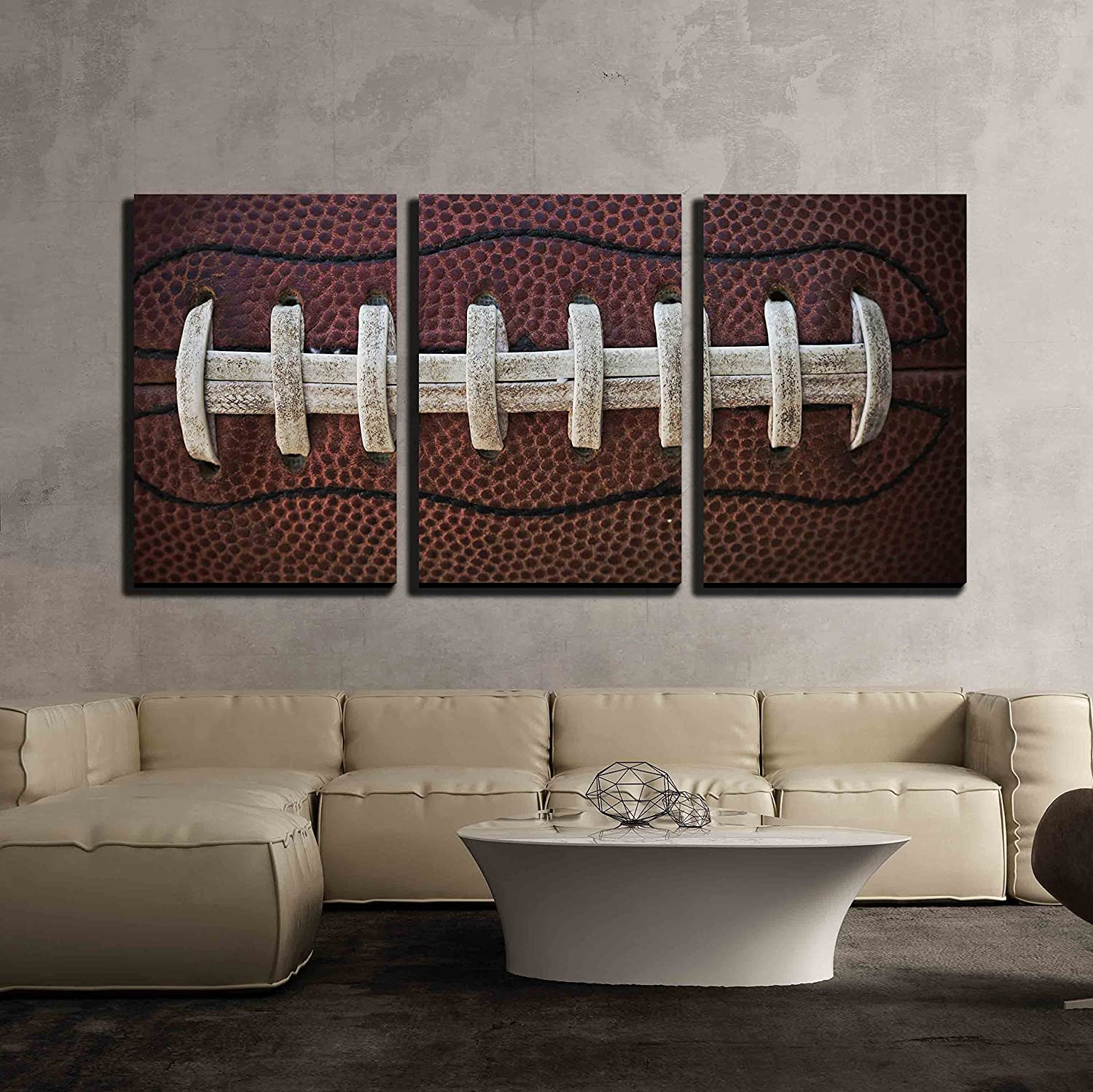 very classic artwork for a football themed room over a couch