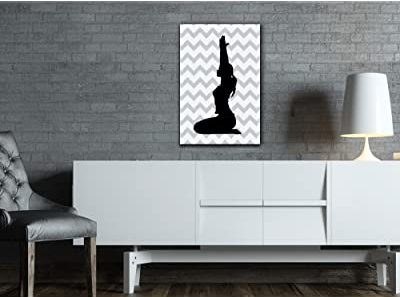 very nice yoga canvas art over a mini bookshelf as sp[iritual room decor ideas