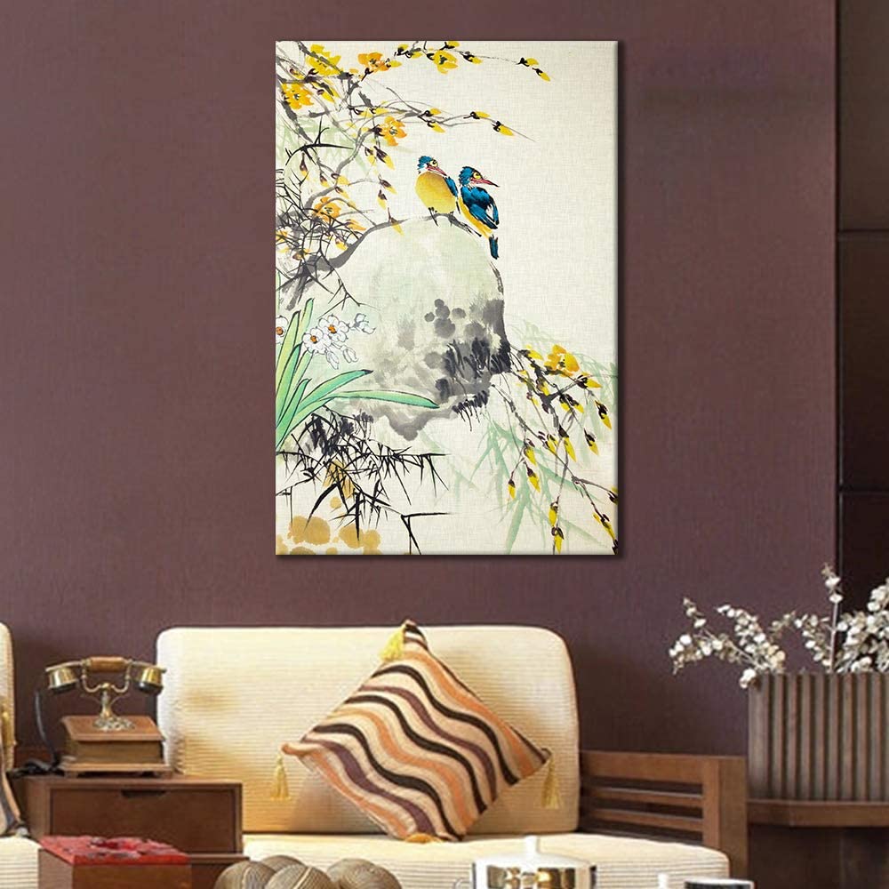 above a chair on the wall is a canvas with two birds
