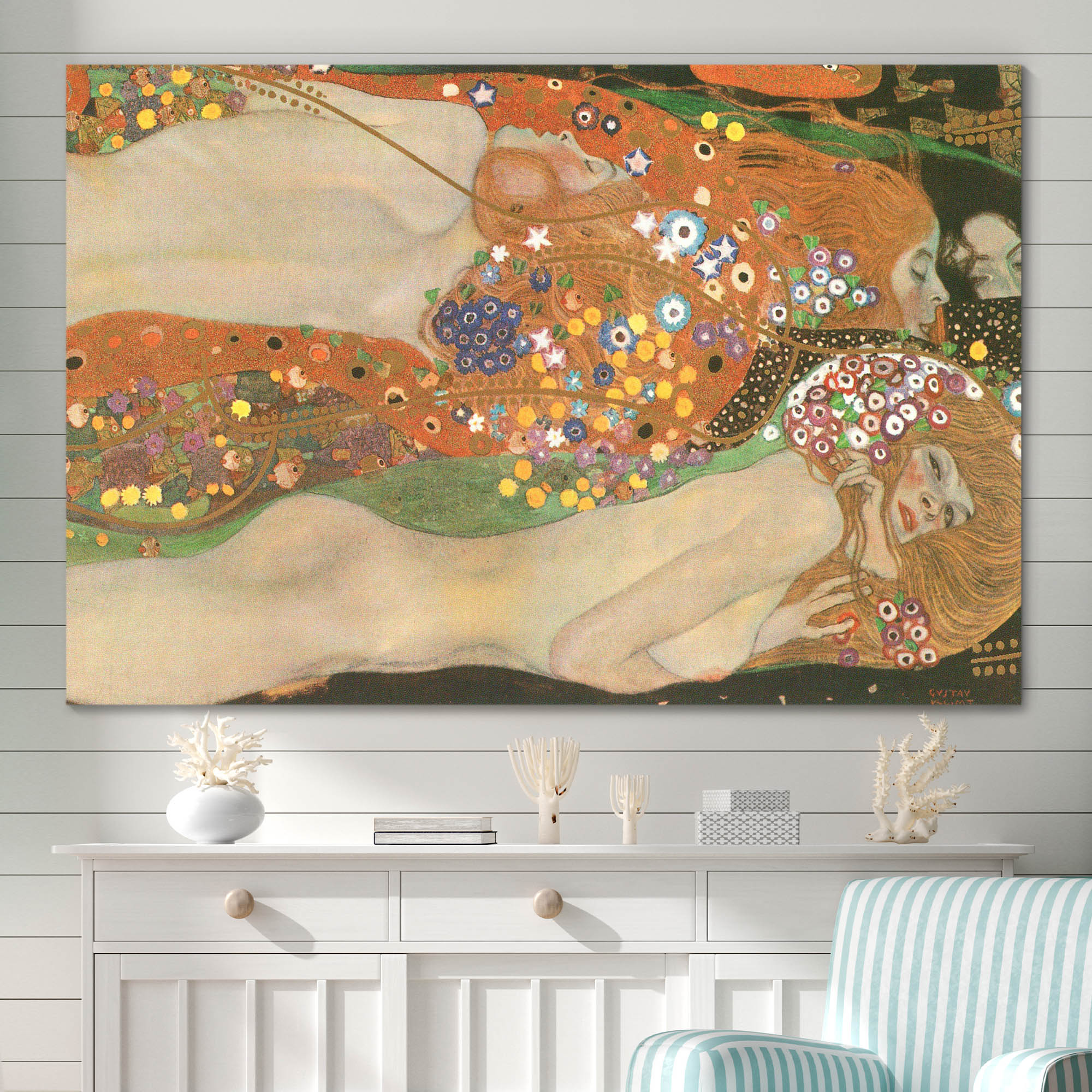 Gustav Klimt's water serpants ii on a wall above a dresser