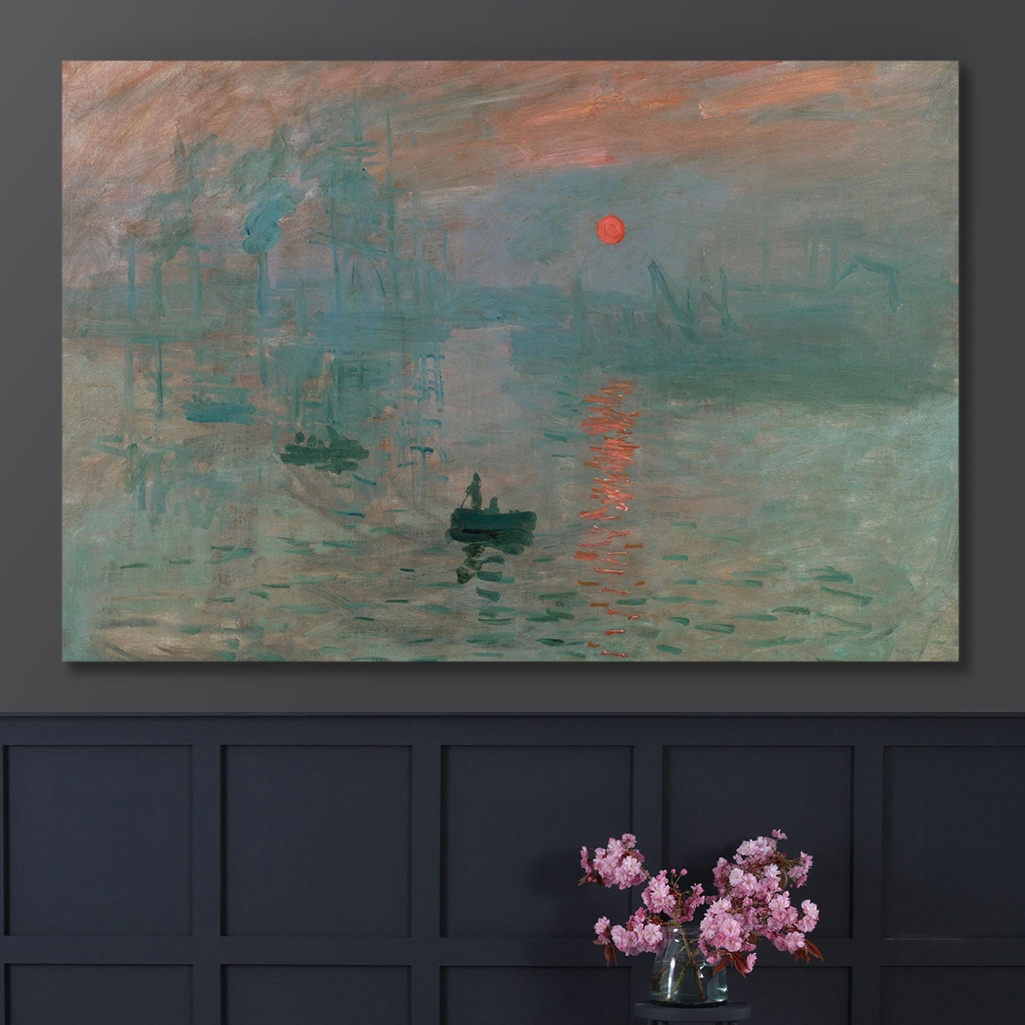 impression sunrise on a wall above a vase